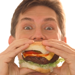 Man Eating Cheeseburger